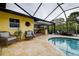 Outdoor pool and entertaining area with a screened enclosure for enjoying the Florida lifestyle at 1117 S Florida Ave, Tarpon Springs, FL 34689