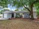 Charming single-story home features a well-maintained lawn, attached garage, and cozy front porch at 1135 17Th Sw Ave, Largo, FL 33778