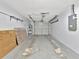 Spacious single-car garage with access door and built-in shelving at 1135 17Th Sw Ave, Largo, FL 33778