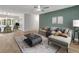 Bright living room features modern furniture, light wood floors, and a large window at 1135 17Th Sw Ave, Largo, FL 33778
