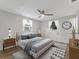Serene main bedroom features neutral decor, stylish furnishings, and soft natural light at 1135 17Th Sw Ave, Largo, FL 33778
