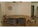 Warm dining room with a wooden table, stylish chairs, and neutral decor for intimate gatherings at 12794 Palm Dr, Largo, FL 33774