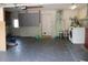 A clean and organized garage featuring ample space, laundry facilities, and efficient storage solutions at 12794 Palm Dr, Largo, FL 33774
