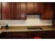 The kitchen features stylish cabinetry, granite countertops and modern appliances at 12794 Palm Dr, Largo, FL 33774