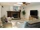 Relaxing living room featuring a fireplace, comfortable seating, and stylish décor at 12794 Palm Dr, Largo, FL 33774