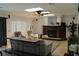 Spacious living room with fireplace, tile flooring and lots of natural light at 12794 Palm Dr, Largo, FL 33774