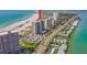 Aerial view of high-rise condos near the beach, and tennis courts at 1290 Gulf Blvd # 702, Clearwater Beach, FL 33767