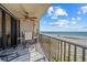 A spacious balcony that features seating and views of the ocean, perfect for outdoor relaxation and enjoying scenic views at 1290 Gulf Blvd # 702, Clearwater Beach, FL 33767