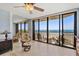 Relaxing balcony view with chairs and tables, overlooking a beautiful beach and ocean at 1290 Gulf Blvd # 702, Clearwater Beach, FL 33767