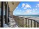Spacious balcony overlooking the beach, with comfortable seating and stunning views at 1290 Gulf Blvd # 702, Clearwater Beach, FL 33767