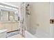 Functional bathroom featuring a shower-tub combo and vanity with plenty of storage at 1290 Gulf Blvd # 702, Clearwater Beach, FL 33767