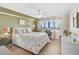 Inviting bedroom with a queen-sized bed, stylish decor, and waterfront views at 1290 Gulf Blvd # 702, Clearwater Beach, FL 33767