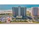 High-rise beachfront condo building with parking, pool, and tennis courts at 1290 Gulf Blvd # 702, Clearwater Beach, FL 33767