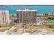 A high-rise condo building is situated near the beach, with parking and a pool at 1290 Gulf Blvd # 702, Clearwater Beach, FL 33767