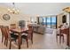 Inviting living room with ocean view, comfortable seating, dining area, and ample natural light perfect for relaxation and entertaining at 1290 Gulf Blvd # 702, Clearwater Beach, FL 33767