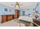 A well appointed main bedroom featuring a canopy bed, dresser and comfortable chair at 1290 Gulf Blvd # 702, Clearwater Beach, FL 33767