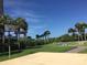Outdoor rec area featuring a basketball court, lawn bowling, and lush landscaping at 1290 Gulf Blvd # 702, Clearwater Beach, FL 33767