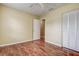 This bedroom features a closet, an entry to another room, and wood flooring at 14047 Briardale Ln, Tampa, FL 33618