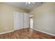 This bedroom has wood flooring, a closet, and an entry to another room at 14047 Briardale Ln, Tampa, FL 33618