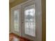 Close up of the front doors with decorative glass panels and bronze hardware at 14047 Briardale Ln, Tampa, FL 33618