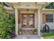 Inviting front entrance with a brick facade, double doors, and decorative potted plants at 14047 Briardale Ln, Tampa, FL 33618
