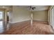 Spacious living room with wood flooring, ample natural light, and ceiling fan at 14047 Briardale Ln, Tampa, FL 33618