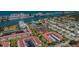 Aerial view of a waterfront community with apartments, boat docks, and beautiful ocean views at 14534 Yacht Club Blvd, Seminole, FL 33776