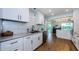 Updated kitchen with stainless appliances, subway tile backsplash, and marble countertops at 14534 Yacht Club Blvd, Seminole, FL 33776