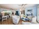 Spacious living room with ceiling fans, stylish furniture, and views into dining and other living areas at 14534 Yacht Club Blvd, Seminole, FL 33776