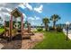 Community playground featuring play equipment and a waterfront view at 14534 Yacht Club Blvd, Seminole, FL 33776