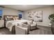 Elegant bedroom with neutral tones, stylish seating area, and bright natural lighting at 14819 Summer Branch Dr Dr, Lithia, FL 33547