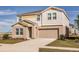 Two story home with neutral color palette, attached garage, and manicured landscaping at 14819 Summer Branch Dr Dr, Lithia, FL 33547