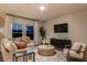 Comfortable living room with stylish decor, a large window, modern furniture, and designer rug at 14819 Summer Branch Dr Dr, Lithia, FL 33547