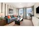 Cozy living room with comfortable sofa, striped accent wall, and movie-themed decor at 14819 Summer Branch Dr Dr, Lithia, FL 33547