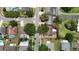 Aerial view of a property in a neighborhood with mature trees near a calm, winding road at 15028 Redcliff Dr, Tampa, FL 33625