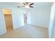 Spacious bedroom with tile flooring, ceiling fan, and natural light at 15028 Redcliff Dr, Tampa, FL 33625