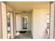 Inviting front entrance featuring a screen door and neutral color scheme at 15028 Redcliff Dr, Tampa, FL 33625