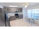 Stylish kitchen featuring stainless steel appliances and an adjacent dining area at 15028 Redcliff Dr, Tampa, FL 33625