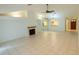 Open-concept living area showcasing a fireplace and neutral tones at 15028 Redcliff Dr, Tampa, FL 33625