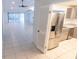 Spacious living room featuring tile floors and sliding glass doors at 15028 Redcliff Dr, Tampa, FL 33625