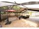 Relaxing screened patio with a hot tub, seating, and durable brick paver floor at 15028 Redcliff Dr, Tampa, FL 33625