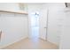 Spacious walk-in closet with tile floor and shelving at 15028 Redcliff Dr, Tampa, FL 33625