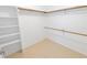 Large walk-in closet featuring ample storage with rods and shelving at 15028 Redcliff Dr, Tampa, FL 33625