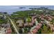A neighborhood with lakes, community pool, and lush tropical greenery at 1536 Ember Ln, Tarpon Springs, FL 34689