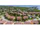 Aerial view of a residential neighborhood featuring well-maintained homes and scenic ponds at 1536 Ember Ln, Tarpon Springs, FL 34689