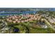 Stunning aerial view of a well-planned community with lakes, lush greenery, and beautiful Mediterranean-style homes at 1536 Ember Ln, Tarpon Springs, FL 34689