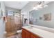 Bathroom featuring a glass-enclosed shower, and a vanity with sink at 1536 Ember Ln, Tarpon Springs, FL 34689