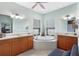 Bathroom featuring a soaking tub, tile floors, and dual vanities at 1536 Ember Ln, Tarpon Springs, FL 34689