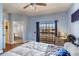Bedroom with wood floor and walk out balcony at 1536 Ember Ln, Tarpon Springs, FL 34689