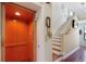 Convenient home elevator next to the stairs provides easy access to all floors of the townhome at 1536 Ember Ln, Tarpon Springs, FL 34689